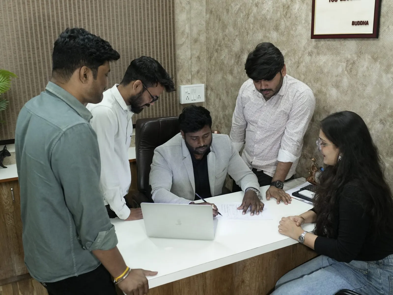 Amit Sharma reviewing a plan with the ROI Makers team